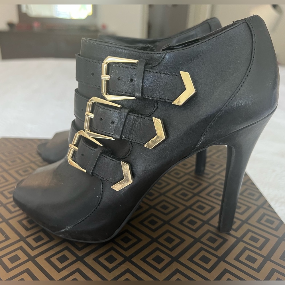 BCBG Paris black leather booties. 4.5” heel. Size 7.5. Never worn.